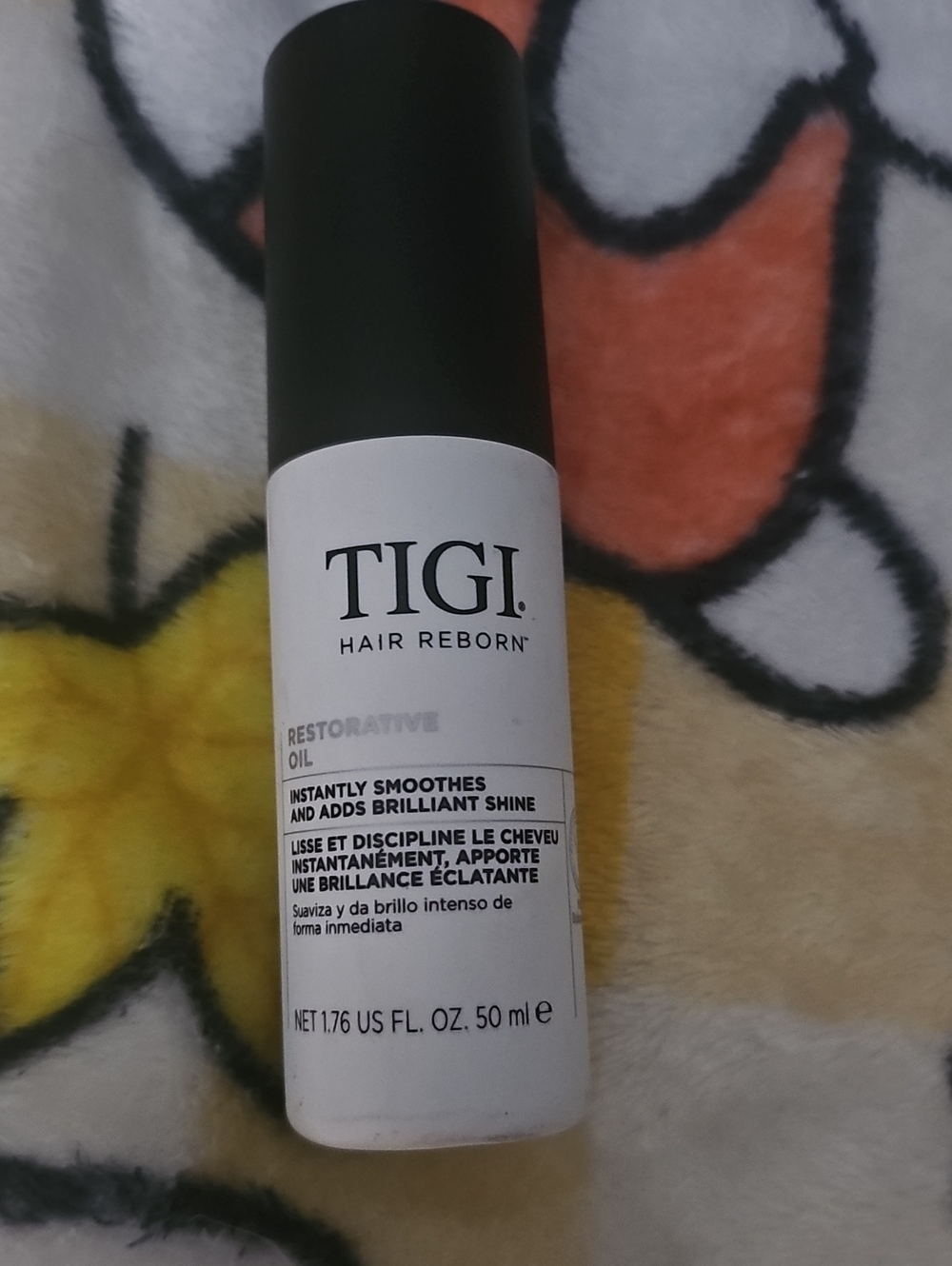 TIGI Hair Reborn Restorative Oil — White and Black Bottle